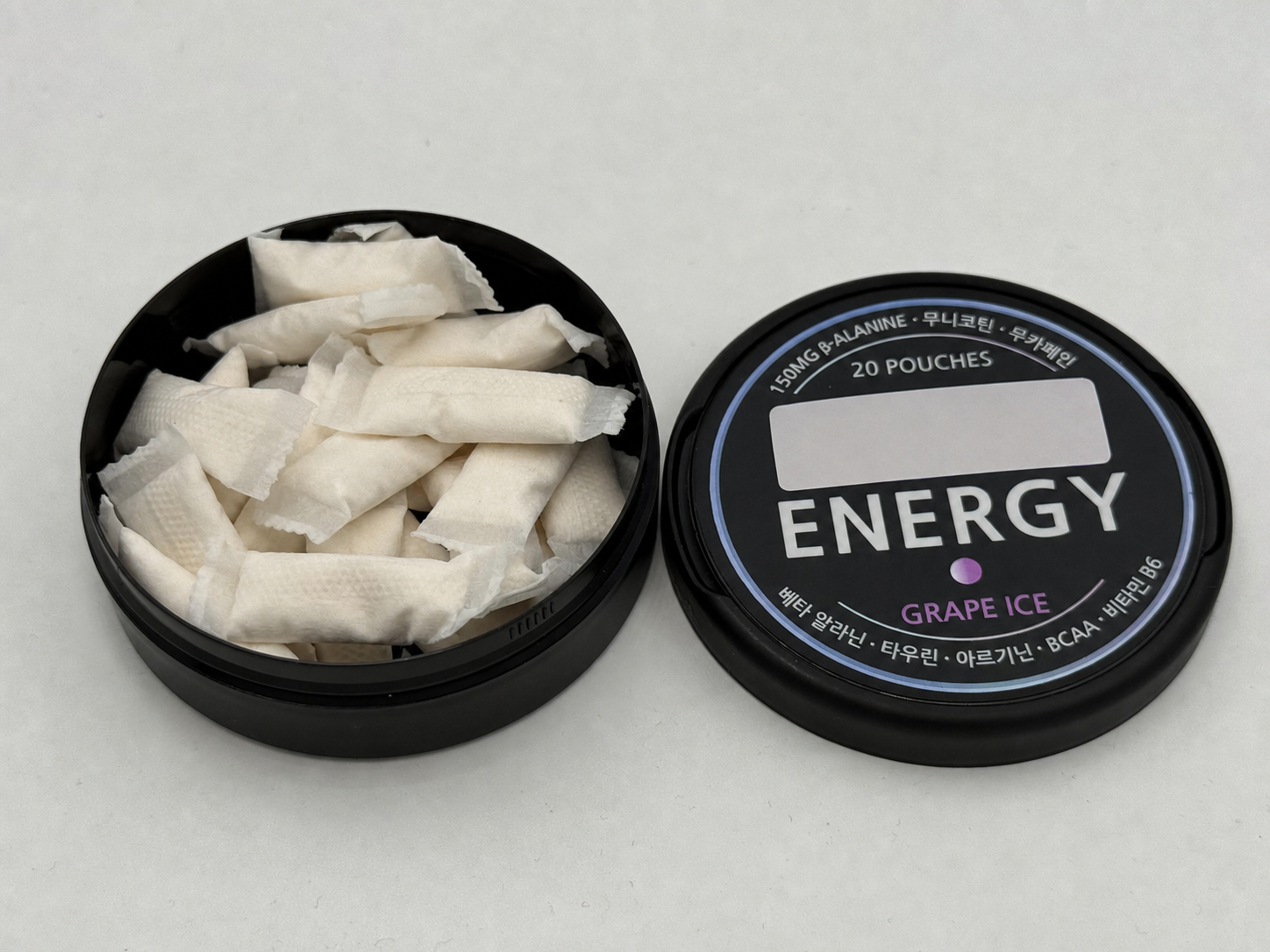 An open energy pouch can and an anonymized energy pouch lid.